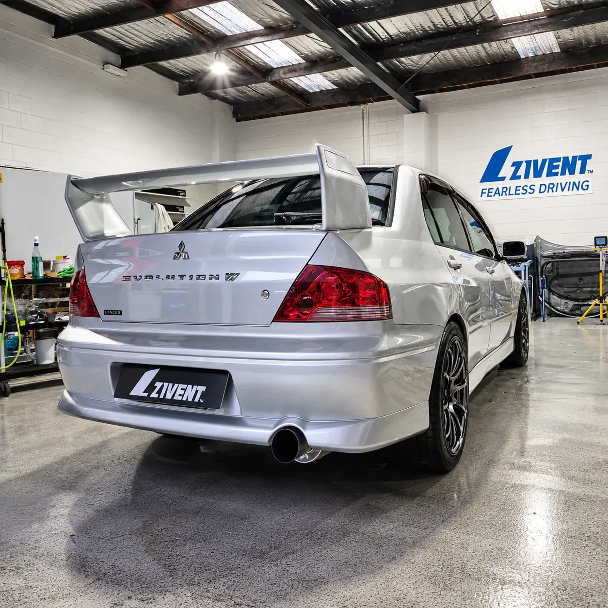 Freshly tinted rear screen on a Mitsubishi Evolution at a Zivent NZ workshop